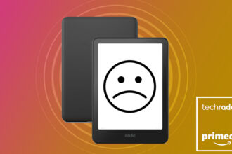 An Amazon Kindle with a sad face drawn on the screen