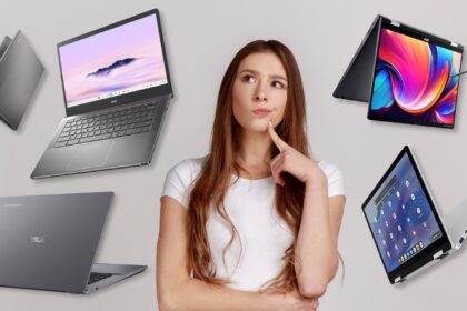 A woman looking thoughtfully at a number of Chromebooks.