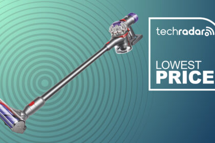 A Dyson stick vacuum on a blue and green background