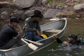 Chad Ollinger prepares to dive into the underwater tunnel in Mystery at Blind Frog Ranch season 5