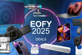 An assortment of tech devices, including a laptop, camera, TV, soundbar and smartwatches, on a blue EOFY deals background