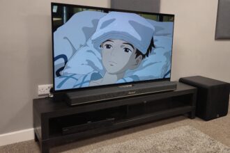 Q Acoustics Q Sub120 next to Marshall Heston 120 with TV playing The Boy and the Heron