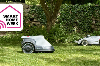 Two robot lawn mowers on some grass, with Smart Home Week logo