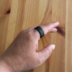 The Ultrahuman Ring Air on an index finger