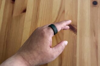 The Ultrahuman Ring Air on an index finger