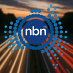 NBN Co logo on a background comprising light trails on a motorway.