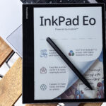PocketBook InkPad Eo with its stylus on a laptop
