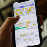 Quordle on a smartphone held in a hand