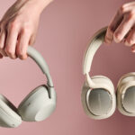 Person holding Sony WH-1000XM6 and Bowers &amp; Wilkins Px7 S3