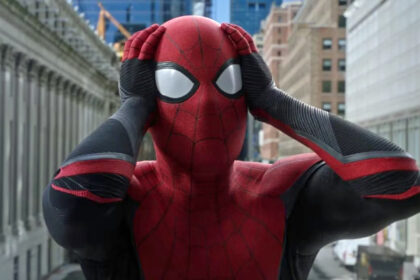 Spider-Man holds his hands to his head in shock in Spider-Man: Far From Home