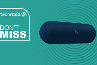 Beats Pill Waterproof Built-in Microphone Wireless Bluetooth Portable Speaker in navy blue on cyan background with TechRadar don't miss sign