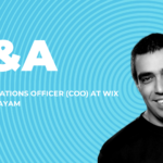 headshot of Ronny Elkayam COO of Wix against a spiral backdrop in blue