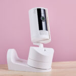 The Ring Pan-Tilt Indoor Cam is shown attached to the wall and ceiling mount.