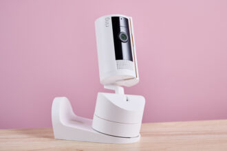 The Ring Pan-Tilt Indoor Cam is shown attached to the wall and ceiling mount.