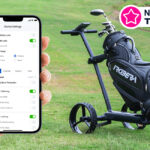 A hand holding a phone next to an AI-powered golf cart