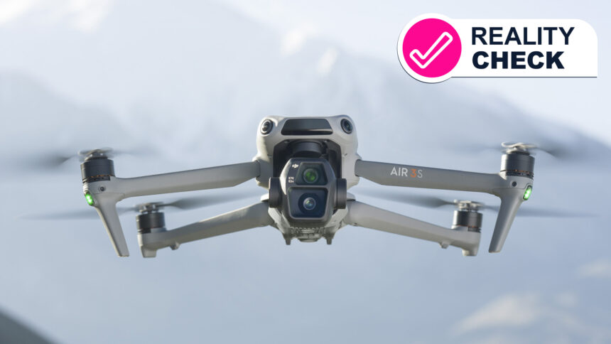 The DJI Air 3S drone flying with some mountains in the background