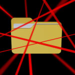 A computer file surrounded by red laser beams