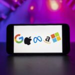 In this photo illustration, the big tech companies Google, Apple, Meta, Amazon, Microsoft logos seen displayed on a mobile phone screen.