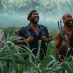 Three member of Zora's team smiling as they look at an off-screen dinosaur in Jurassic World Rebirth