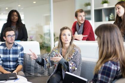 Employees sat around together discussing business issues.