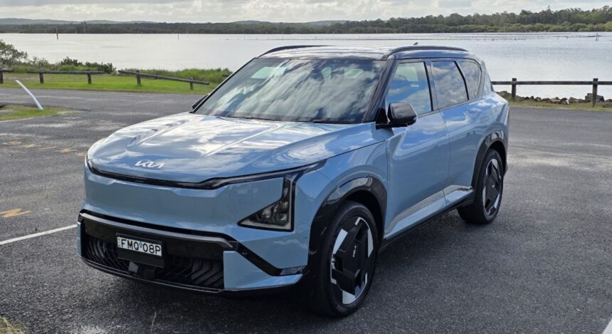 The Kia EV5 parked by a lake