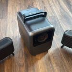 Anker Nebula X1 with speakers on floor