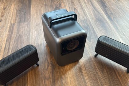 Anker Nebula X1 with speakers on floor