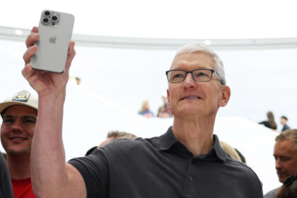Tim Cook with iPhone 15