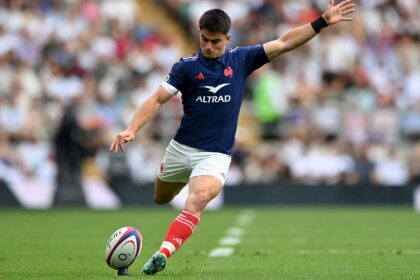 Nolann Le Garrec kicks a conversion off the tee in a match against England Rugby.