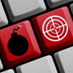 A bomb and crosshair on a keyboard.