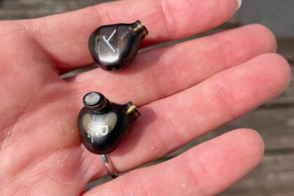 DT 72 IE in a hand, showcasing the small driver housings