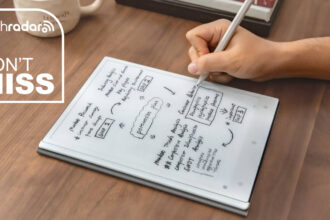 A person writing on the ViWoods AiPaper productivity tablet with a TechRadar deals inset saying &quot;don't miss&quot;