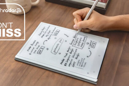 A person writing on the ViWoods AiPaper productivity tablet with a TechRadar deals inset saying &quot;don't miss&quot;