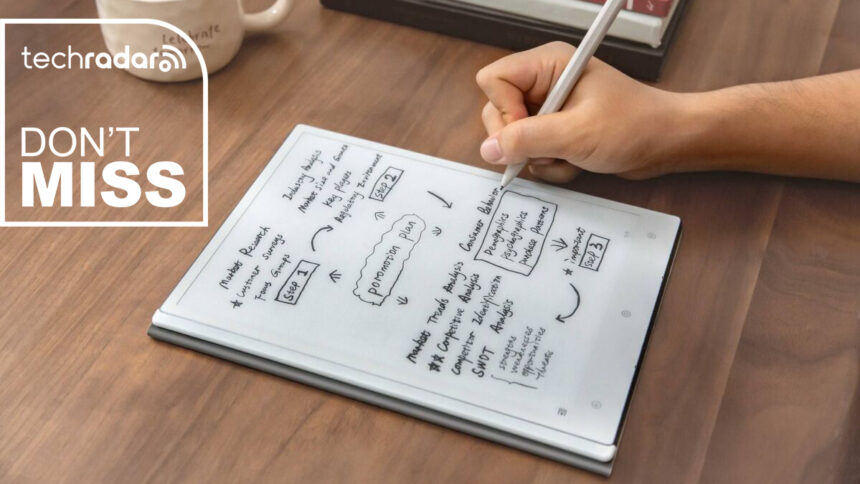 A person writing on the ViWoods AiPaper productivity tablet with a TechRadar deals inset saying &quot;don't miss&quot;