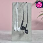 ZJXD wired earbuds on block with words '$5 challenge' positioned in the top right of the image