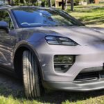The Porsche Macan electric car parked on grass