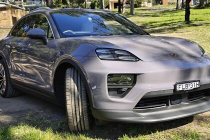 The Porsche Macan electric car parked on grass