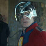 Chris Smith looking behind him as he wears his metahuman costume in Peacemaker season 2 episode 1