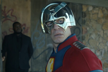 Chris Smith looking behind him as he wears his metahuman costume in Peacemaker season 2 episode 1
