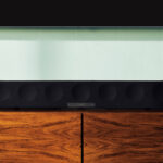 Sennheiser Ambeo Soundbar Max on a wooden entertainment unit