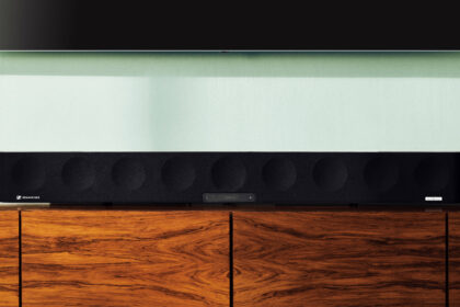 Sennheiser Ambeo Soundbar Max on a wooden entertainment unit