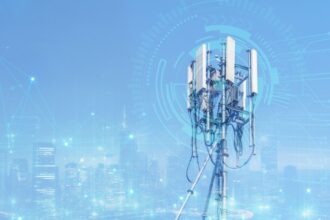Telecommunication tower or Mobile phone tower with 5G cellular network . Global connection and internet network concept.on city background.