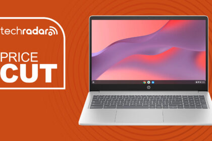 HP Chromebook Laptop 15a in silver on orange background with TechRadar price cut sign