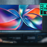 The Dolby Vision 2 logo, with a TV showing a colorful image, watched by a woman