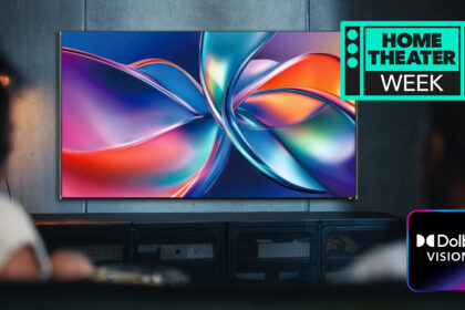 The Dolby Vision 2 logo, with a TV showing a colorful image, watched by a woman