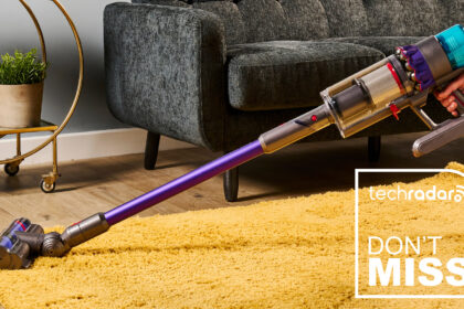 Dyson Gen5 Detect vacuum cleaner being used on a yellow rug