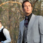 Ed and Lorraine Warren look on in disbelief at someone off camera in The Conjuring