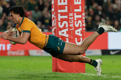 Australia centre Joseph Aukuso-Suaalii dives to score a try in his side's first Rugby Championship 2025 match against South Africa.