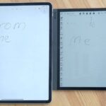The Onyx Boox Tab Ultra C next to an iPad Pro on a wooden table