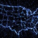 Outline map of US states in glowing blue with exploding streams of binary data illustrating communication, internet and technology